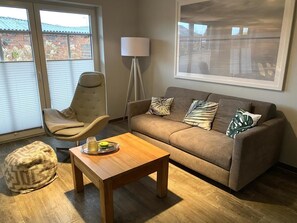 Wohnzimmer mit Auszugsofa