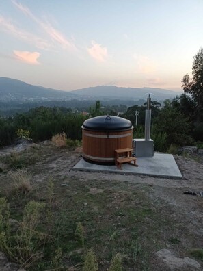 Enjoy the stunning views by day or night at our wood fired hot tub