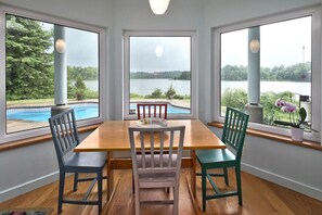 Enjoy breakfast in kitchen nook overlooking the lake and pool