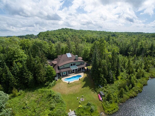 Grace House is on a private lake, with swimming pool.