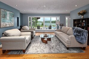 Living room is spacious and overlooks the lake.