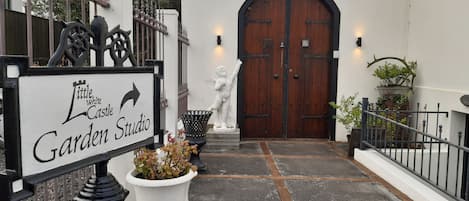 Main entrance to the Garden Studio & the Secret Garden is through the arch door.