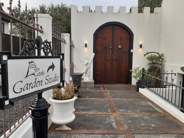 Main entrance to the Garden Studio & the Secret Garden is through the arch door.