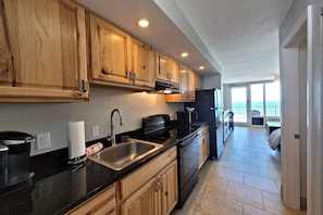 Brand new kitchen nicely stocked to make your own meals during your stay.