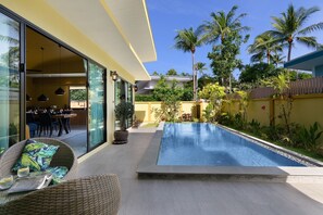 Villa Baan Putahracsa. .Solar panels catch the sun and the roof gives some shade