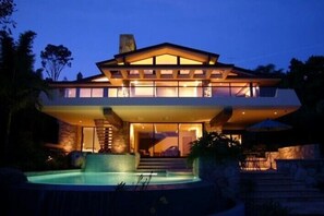 Cantilevered balcony overlooks pool and spa