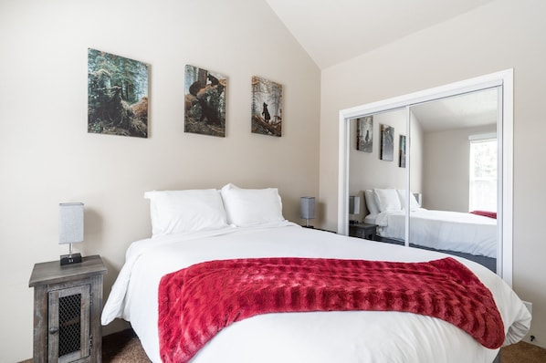 Queen bed in bedroom.