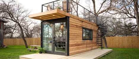 Beautiful 20' container home with upper deck.