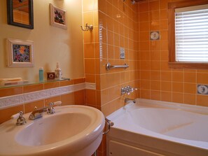 Suite 1 Bathroom with deep Jacuzzi whirlpool tub.