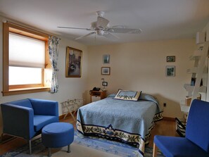 Guest Suite 1, "The Holland Room" with double bed, 2 chairs, luggage racks.