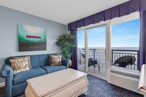 A cozy retreat in the living room with an ocean backdrop!