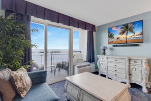 A cozy retreat in the living room with an ocean backdrop!