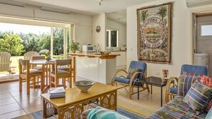 Large main living area, kitchen, dining area and bathroom.