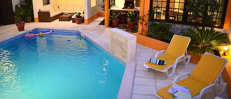 Pool area with sun loungers