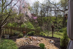 Enjoy your morning cup of coffee on the patio and enjoy the view. This rock garden is directly to the left of patio and view right outside bedroom window.