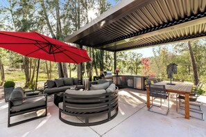 fire pit, outdoor kitchen, and living under the shade pergola with view all around