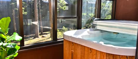 Private jacuzzi located on enclosed sun room.