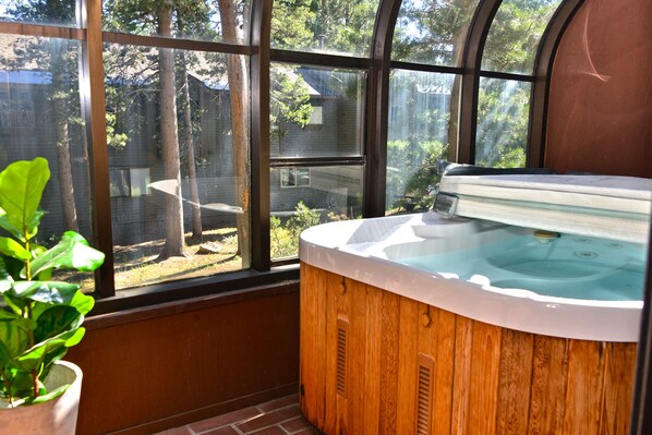 Private jacuzzi located on enclosed sun room.