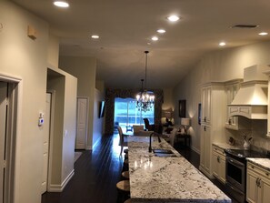 Kitchen area overlooking living room and pool