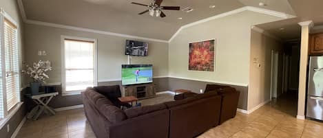 Living room with two televisions to watch multiple games at the same time. 