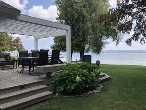 Large private deck with outdoor seating and eating area