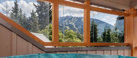 Soak in your private hot tub with a view of both Blackcomb and Whistler mountain