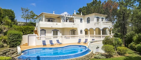 View across garden and pool to the property