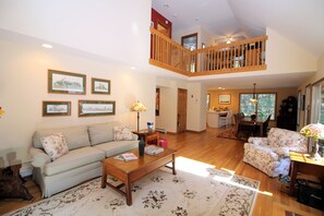 Open living area with dining area and kitchen beyond