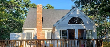 Sun room with sliders to deck