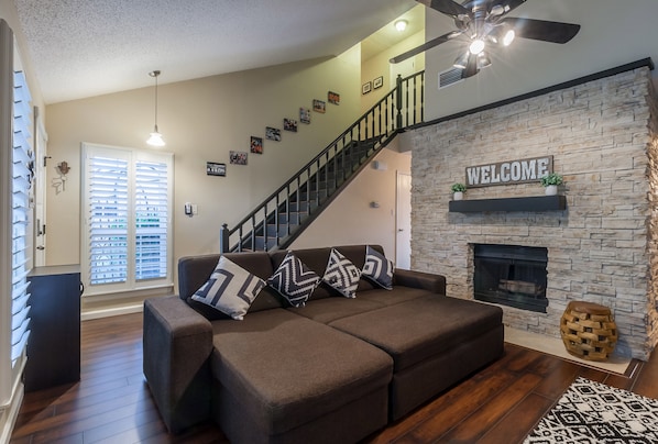 Living room with a half bathroom.