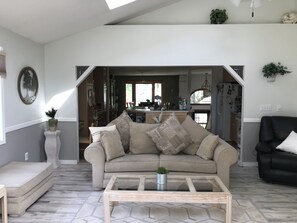 Formal living room looking into the kitchen area