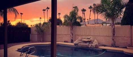 Private backyard pool at sunset. The pool is 8' deep and warm May to October