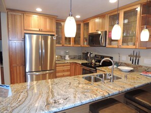 Kitchen with granite counter top, open concept