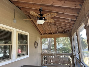 screened in porch with fan