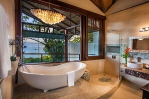 The master bathroom is a display of elegance with natural elements.