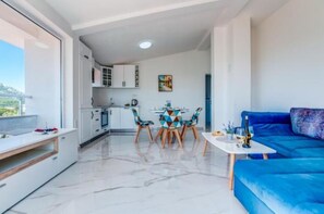 Living room in your villa is relaty bright and spacious