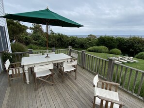 Outdoor deck, with south facing, ocean views, opens to indoors and yard 