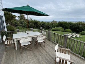 Outdoor deck, with south facing, ocean views, opens to indoors and yard 