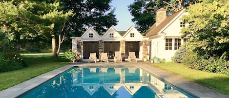 View of the pool and cottage from the grape arbor