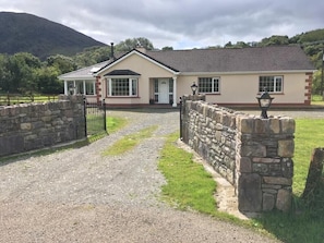 Access this bungalow on the flat drive through wrought iron gates 