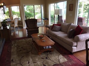 Comfortable couch and swivel recliner to relax and watch the fire 