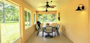 Huge Screened porch with table, chairs, 3 decorator ceiling fans and Gas Grill