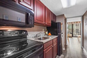 Cook up in our kitchen equipped with necessary appliances!