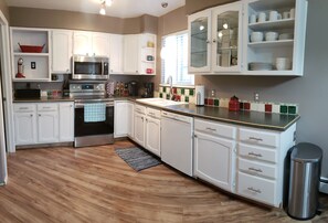 Roomy kitchen with modern, stainless appliances and all the essentials!