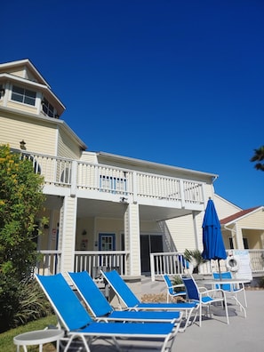 Pool area: chairs, tables, bbq pits