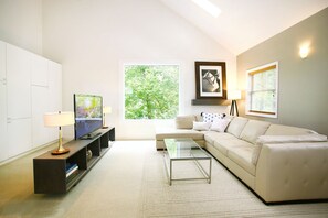 Living room with a view, gorgeous 5 ft. window.  Ever-changing scenery.  