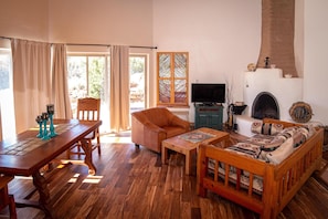 Living room with Kiva wood burning fireplace