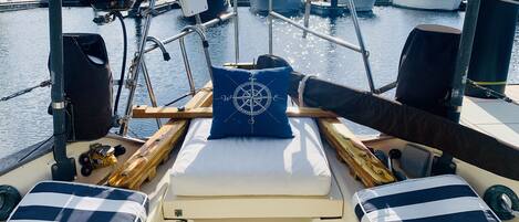 Lounge on the rear deck of the boat right on the water!
