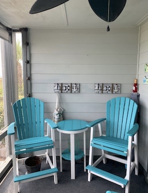 Another view of patio with high chairs. 