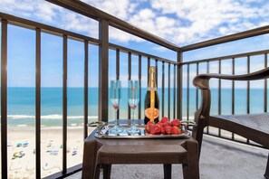 Transform the balcony into your oceanfront lounging deck, with comfortable seating and a wide-open view of the sea for a perfect relaxation spot.